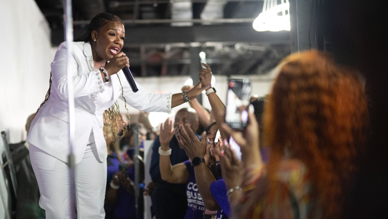 Rep. Cori Bush, a Missouri Democrat, gestures to the crowd prior to delivering her concession speech during a primary election watch party at Chevre Events, St. Louis, Aug. 6, 2024. (Michael B. Thomas/Getty Images)