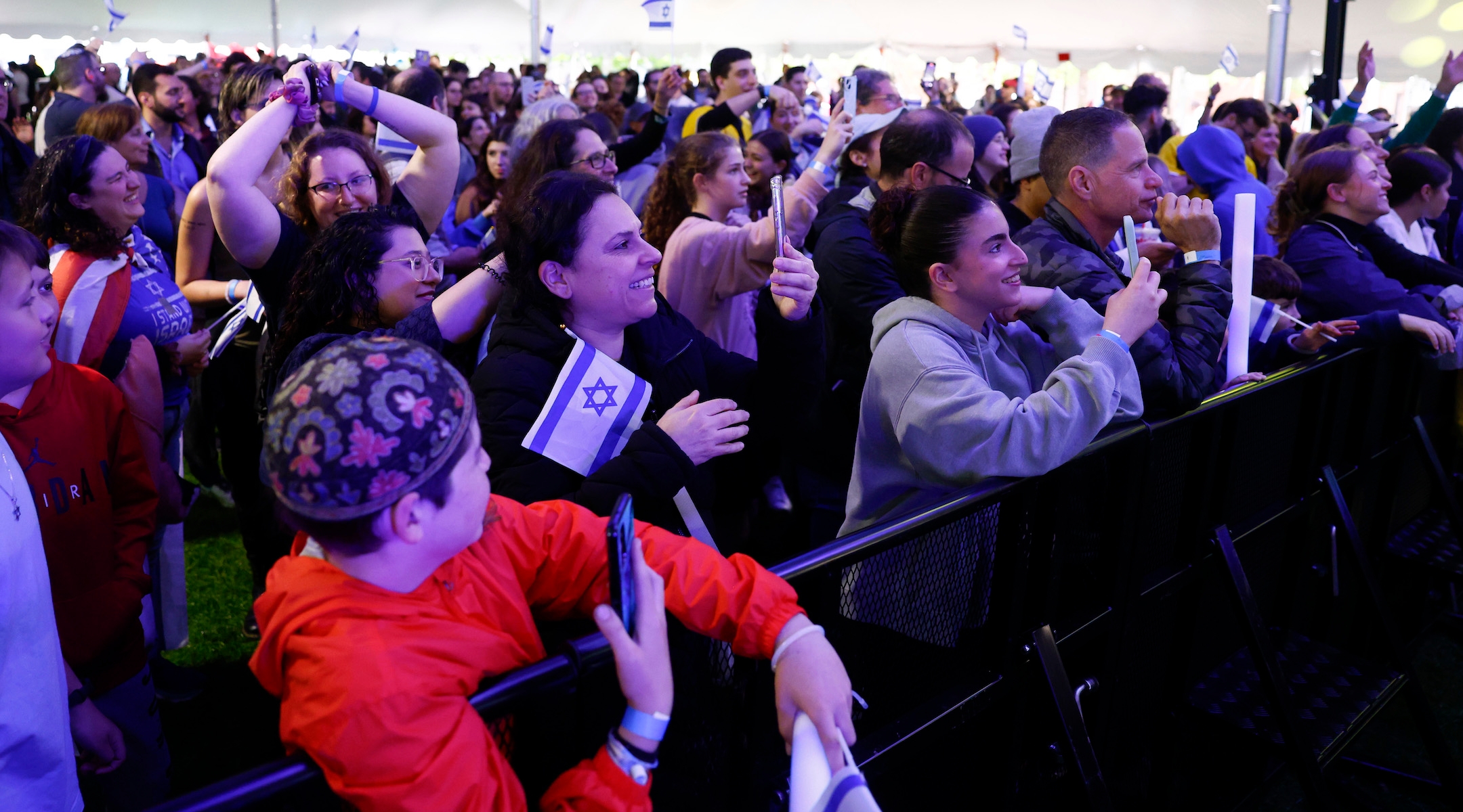 A crowd watches rapper Kosha Dillz perform during the “We Will Dance Again” event presented by MIT Hillel in Cambridge, Massachusetts, May 16, 2024. Hillels have come under fire from some campus encampments, which have demanded schools cut ties with them. (Danielle Parhizkaran/The Boston Globe via Getty Images)