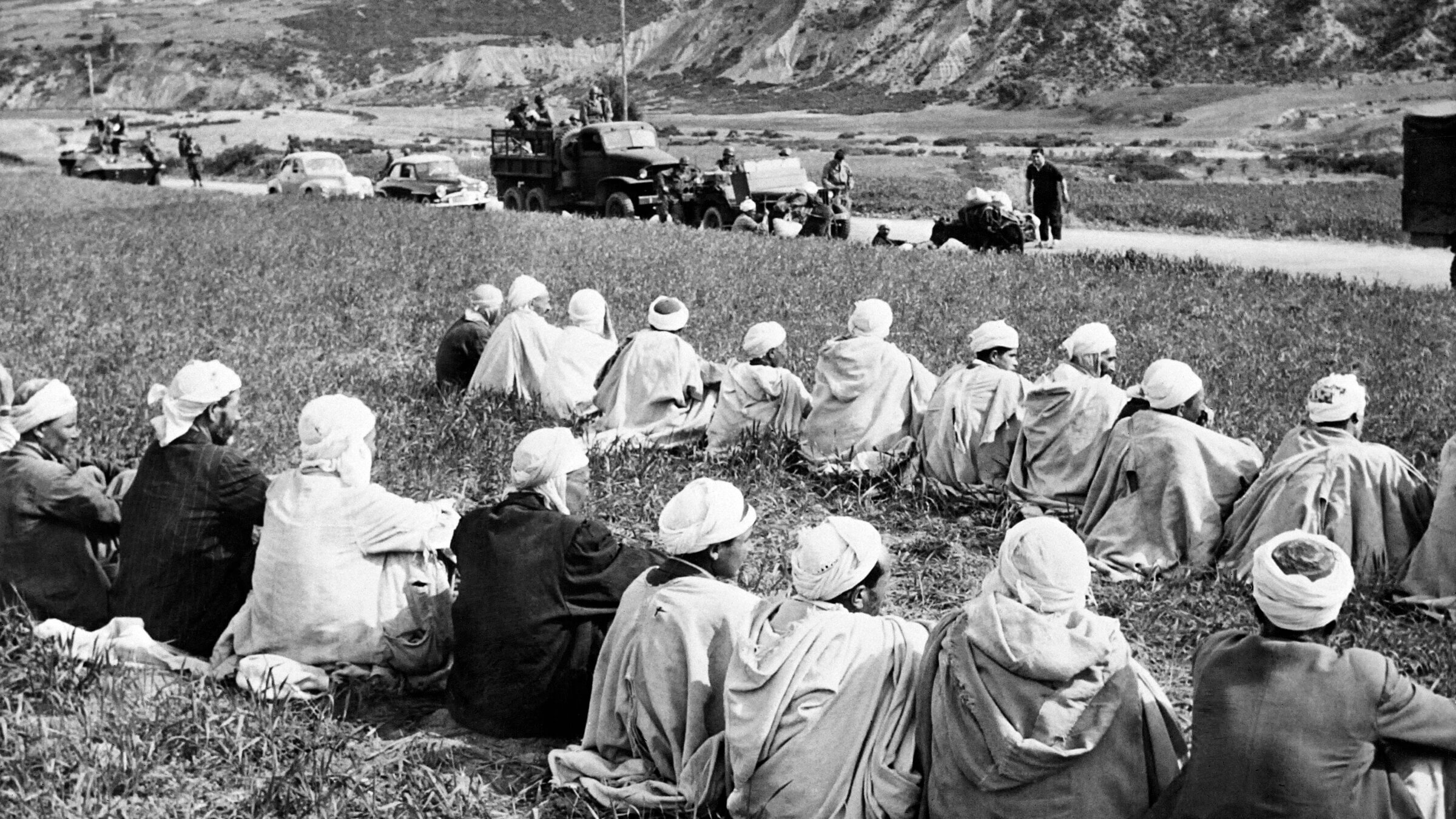 Algerian suspects waiting to be searched and questioned in Algeria, 1956.