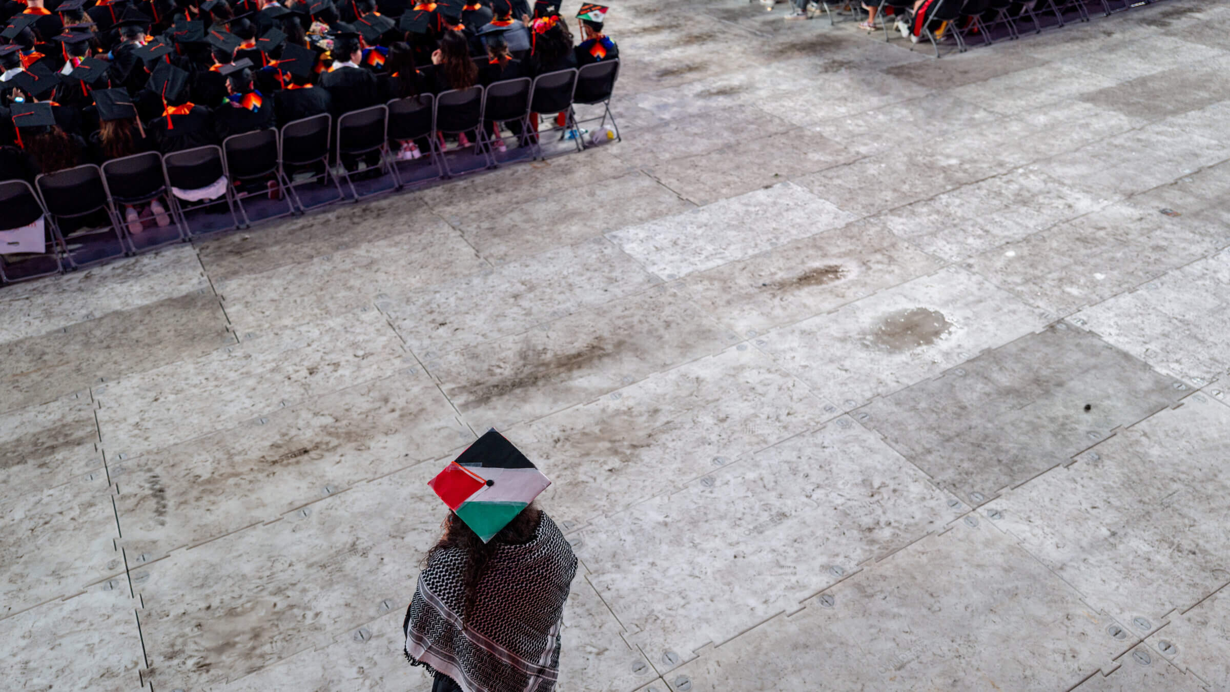 A graduate student pictured during commencement at the University of Texas in May.