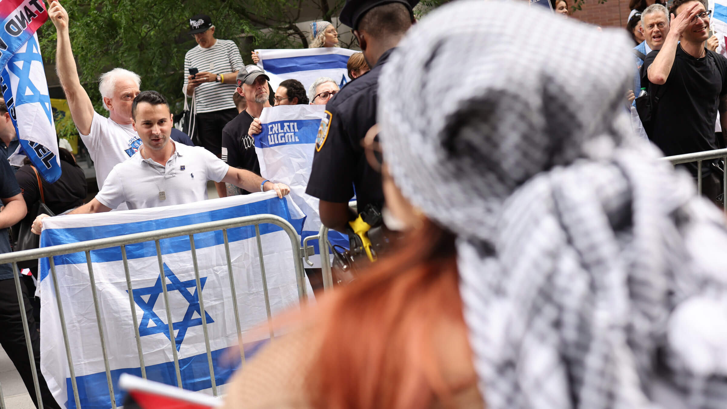 Protesters face off at Baruch College in June.