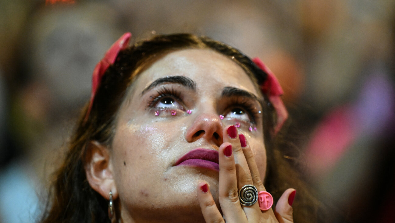 In Tel Aviv, a woman takes part in a protest against the Israeli government.