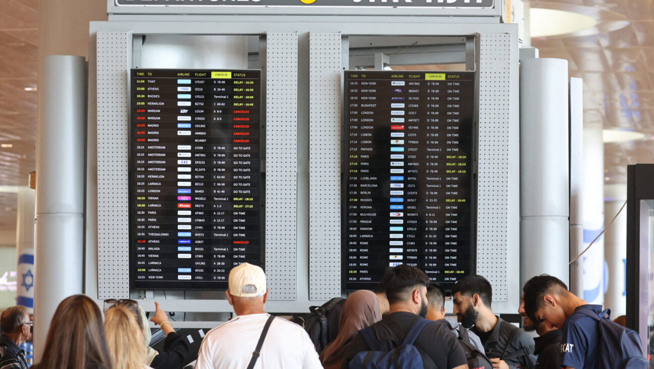 Passengers check their flights at Ben Gurion Airport near Tel Aviv, on Aug. 6, 2024, amid regional tensions during the ongoing war between Israel and the Palestinian Hamas movement in the Gaza Strip. (Gil Magen-Cohen/AFP via Getty Images)