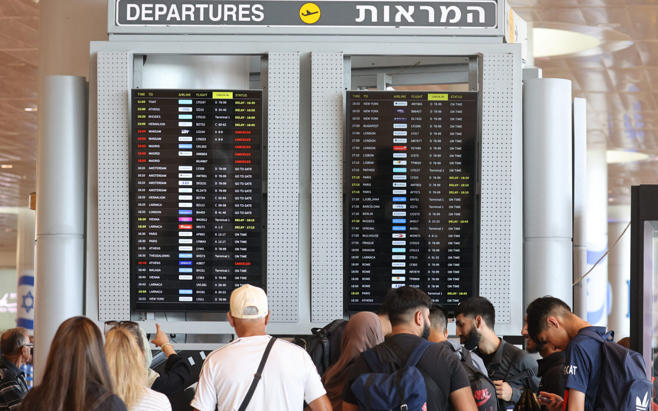 Passengers check their flights at Ben Gurion Airport near Tel Aviv, on Aug. 6, 2024, amid regional tensions during the ongoing war between Israel and the Palestinian Hamas movement in the Gaza Strip. (Gil Magen-Cohen/AFP via Getty Images)