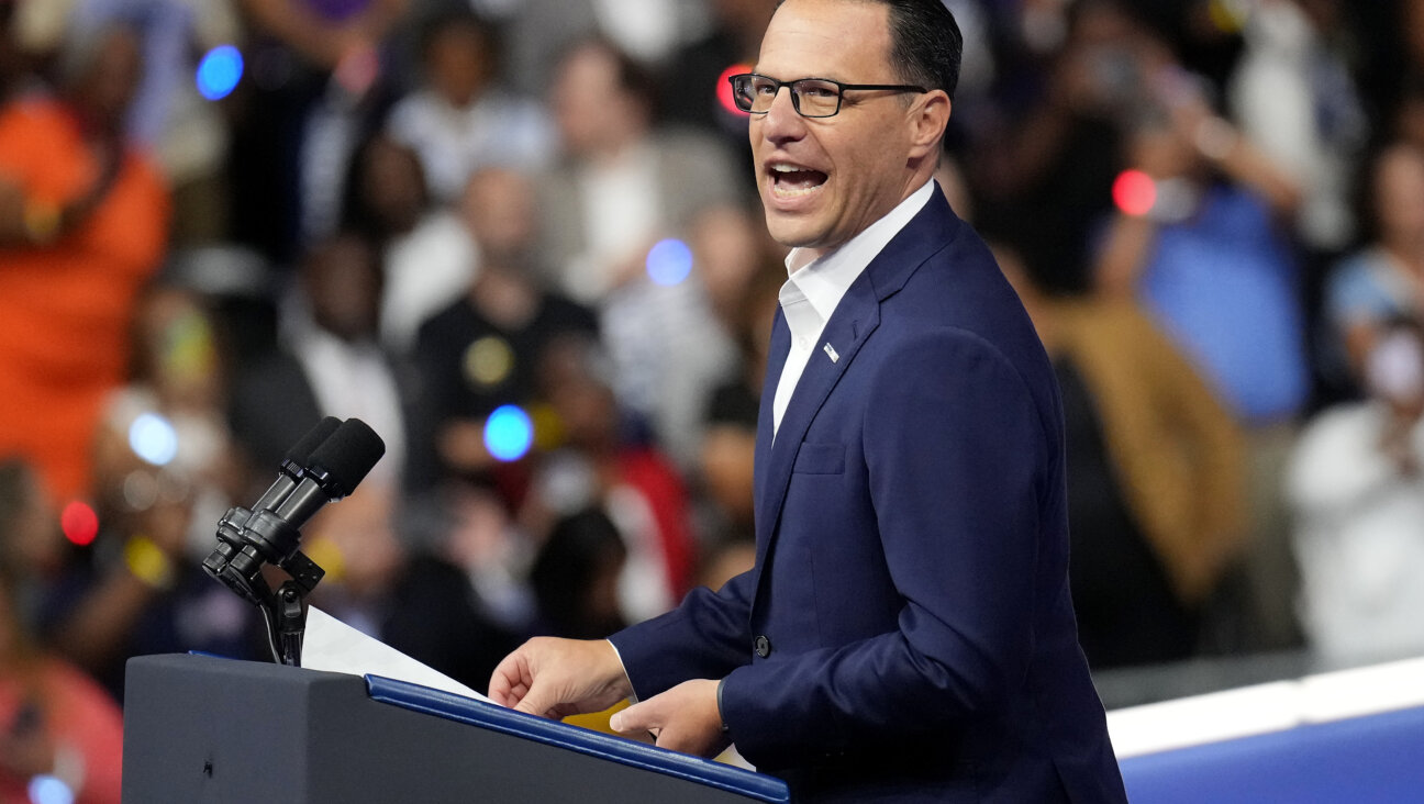 Pennsylvania Gov. Josh Shapiro greets the crowd before the start of a campaign rally with Democratic presidential candidate Kamala Harris and vice presidential candidate Tim Walz Aug. 6 in Philadelphia.