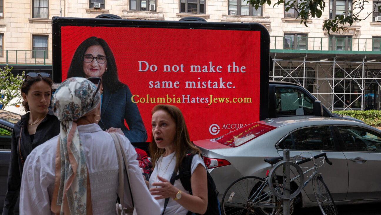 An auto billboard featuring an image of Minouche Shafik, the Columbia University president who resigned, circles the New York City campus the day after she stepped down, Aug. 15, 2024. (Spencer Platt/Getty Images)