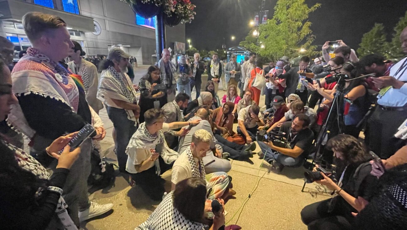 "Uncommitted" delegates to the Democratic National Convention staged a sitin outside the United Center Wednesday night to demand a Palestinian-American be allowed to speak from the main stage. 