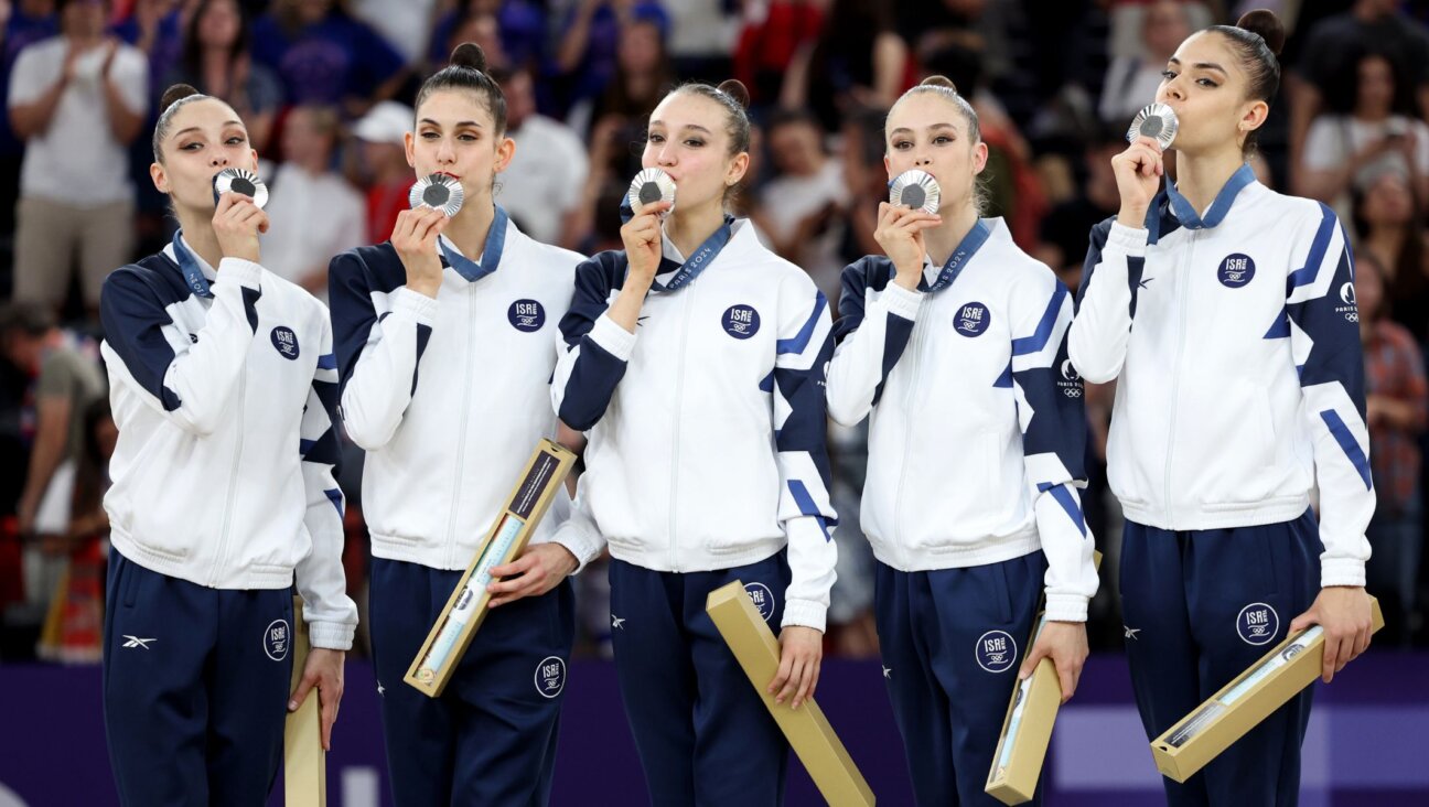 Israel’s rhythmic gymnastics team celebrates on the podium during the rhythmic gymnastics group all-around medal ceremony at the 2024 Paris Olympics, Aug. 10, 2024, in Paris. (Jamie Squire/Getty Images)