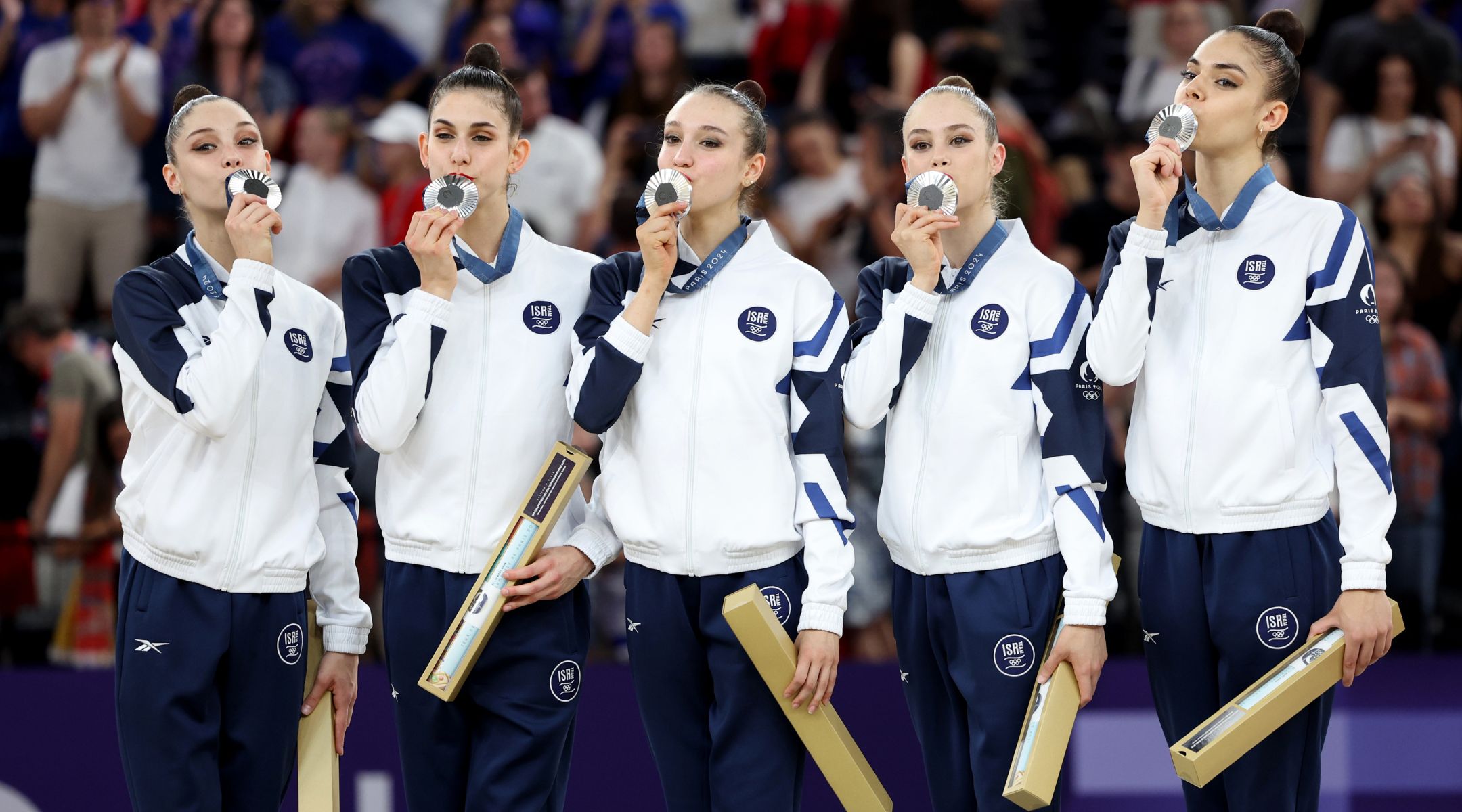 Israel’s rhythmic gymnastics team celebrates on the podium during the rhythmic gymnastics group all-around medal ceremony at the 2024 Paris Olympics, Aug. 10, 2024, in Paris. (Jamie Squire/Getty Images)