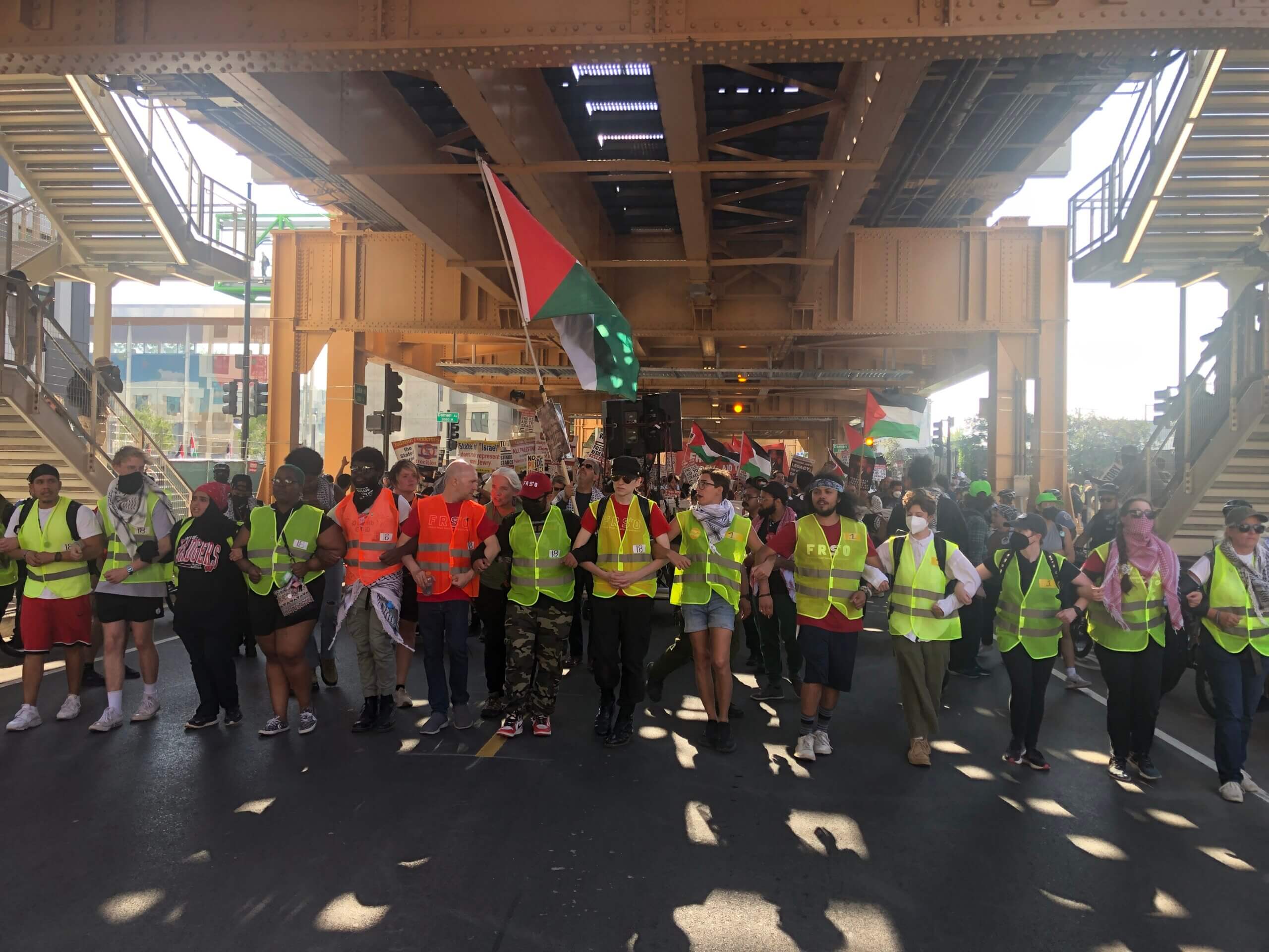 Protesters marched under the L train in Chicago on the first day of the Democratic National Convention.