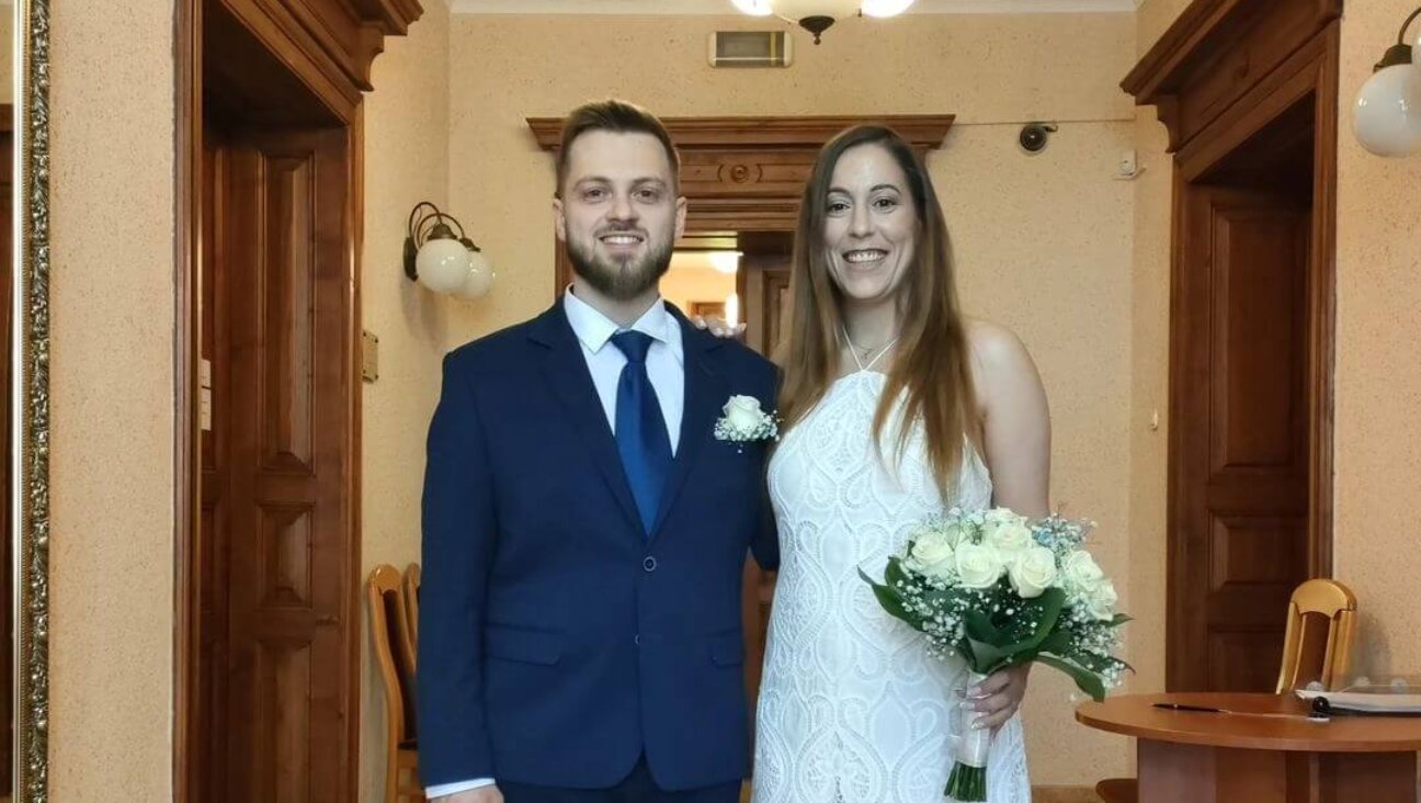 Kamil Gut and Hila Weisz celebrate their wedding at the Oswiecim town hall.