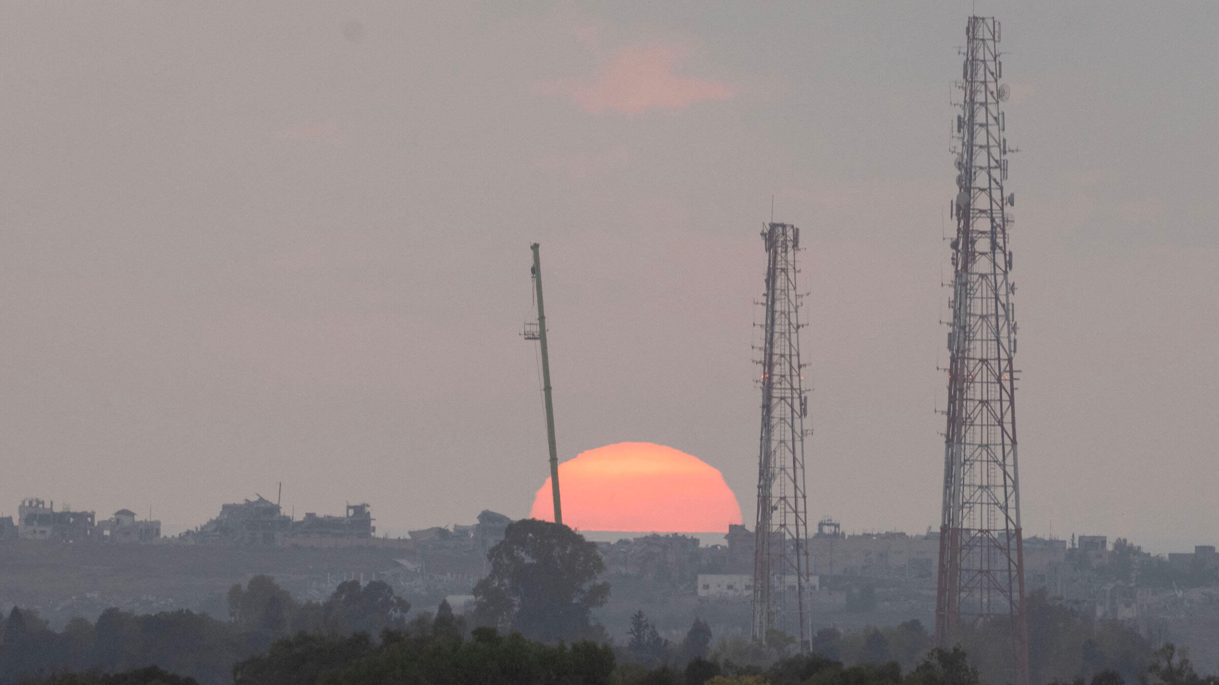 The sun sets over the Gaza Strip, as seen from an area close to Kibbutz Sa'ad.