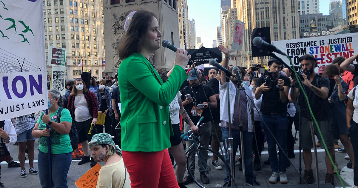 Rabbi Abby Stein speaks at the rally at Michigan Avenue and the Chicago River on Sunday, combining advocacy for abortion rights and an end to the war in Gaza.