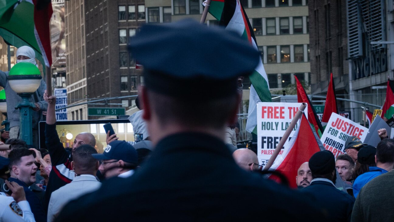 Police separate Israel supporters and pro-Palestinian demonstrators in Times Square, New York City, October 13, 2023. (Luke Tress)