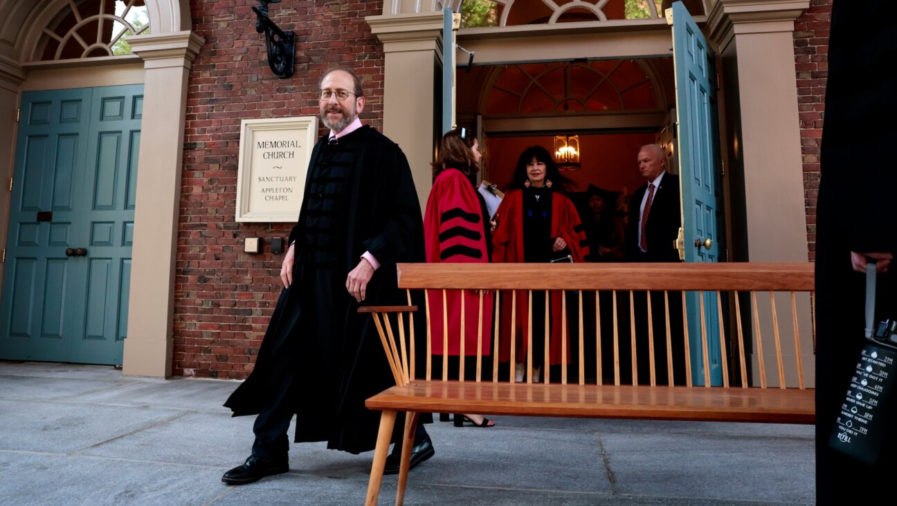 Then-interim president of Harvard University, Alan Garber, arrives for a photo with honorees before the 373rd Commencement at Harvard University. (Craig F. Walker/The Boston Globe via Getty Images)