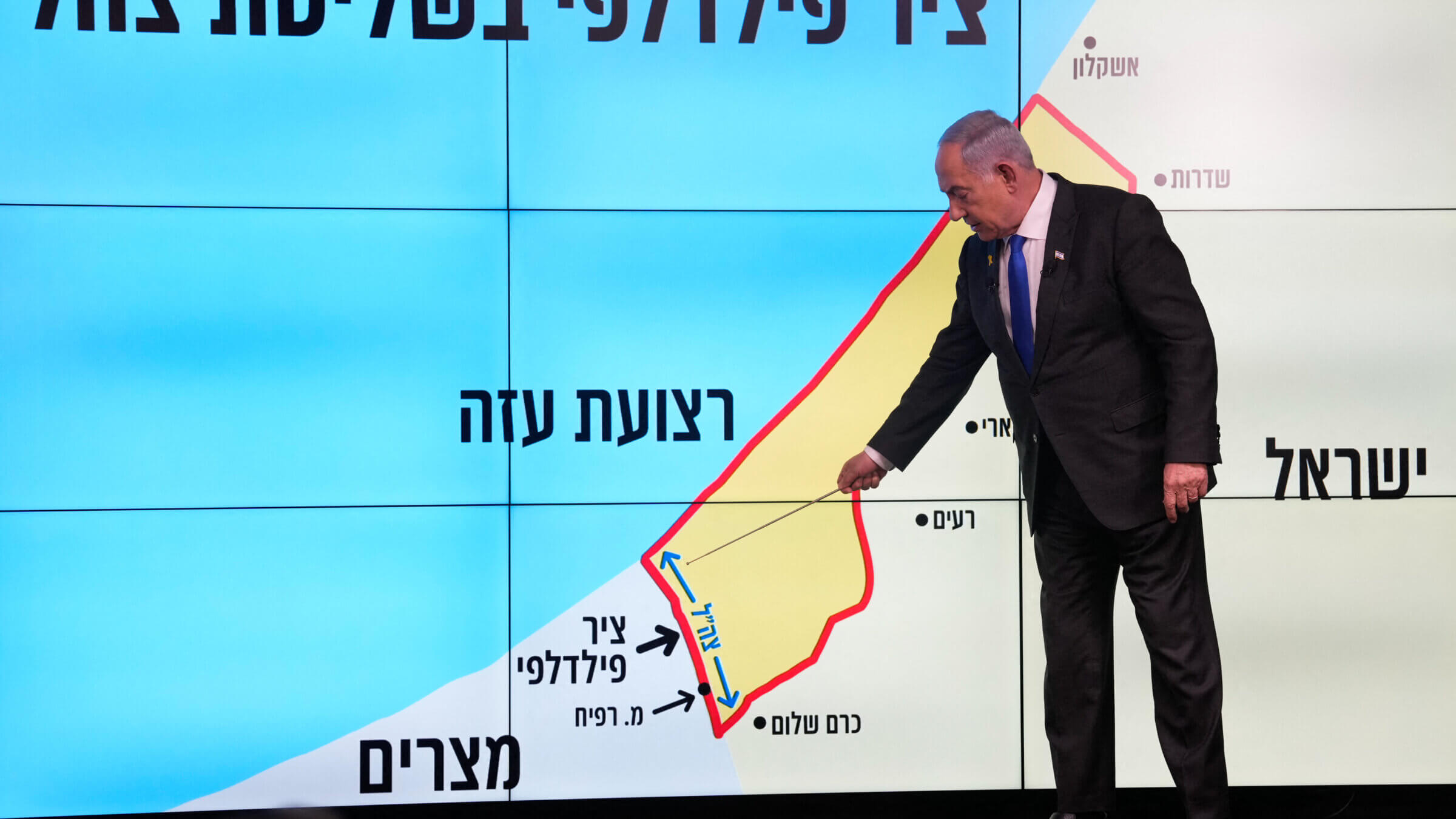 Israeli Prime Minister Benjamin Netanyahu stands before a map of the Gaza Strip, telling viewers that Israel must retain control over the "Philadelphi corridor," a strategic area along the territory's border with Egypt.