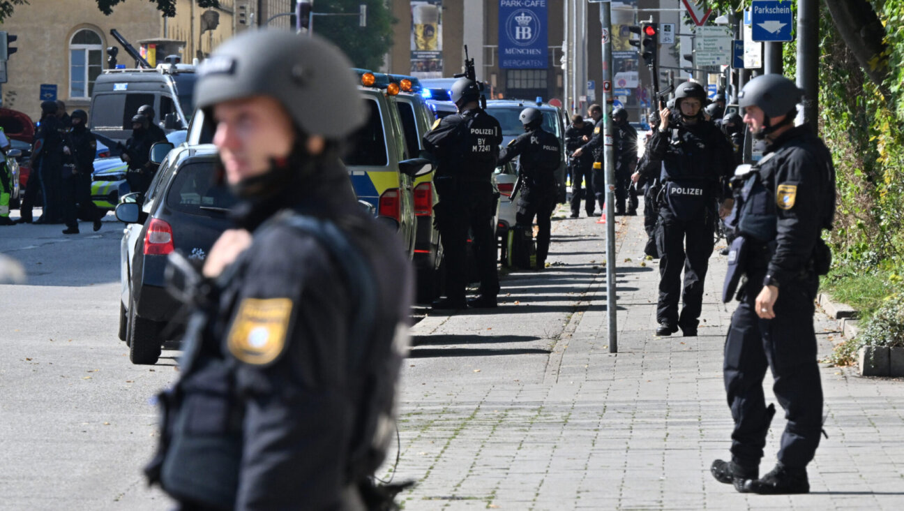 Police officers line the streets of Munich after shooting a man with a gun during a major operation near the Israeli Consulate General. (Peter Kneffel/picture alliance via Getty Images)