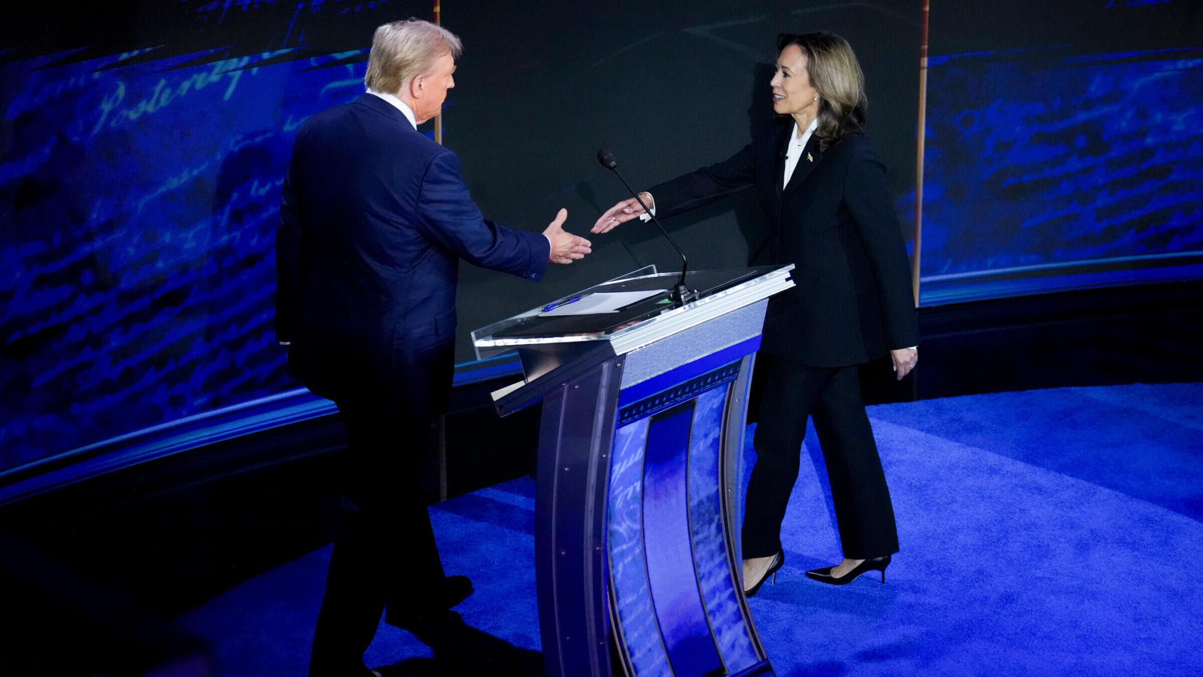 Vice President Kamala Harris and former President Donald Trump shake hands before the presidential debate.