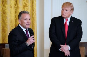 Then President Donald Trump watches his friend Steve Witkoff, who's son died of a prescription drug overdose, speak at the White House Opioid Summit in March 2018. 