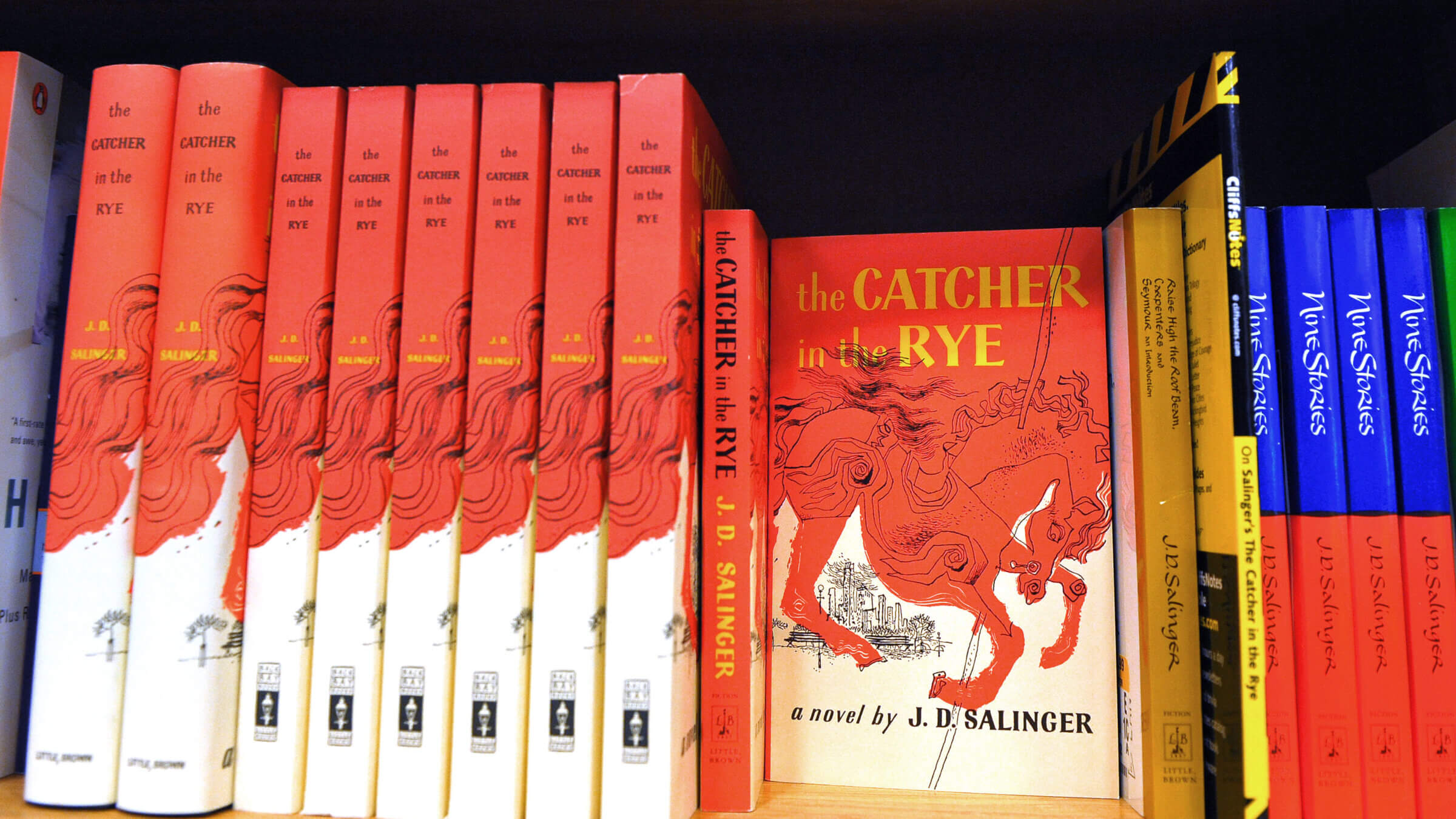 Copies of "The Catcher in the Rye" by author J.D. Salinger.