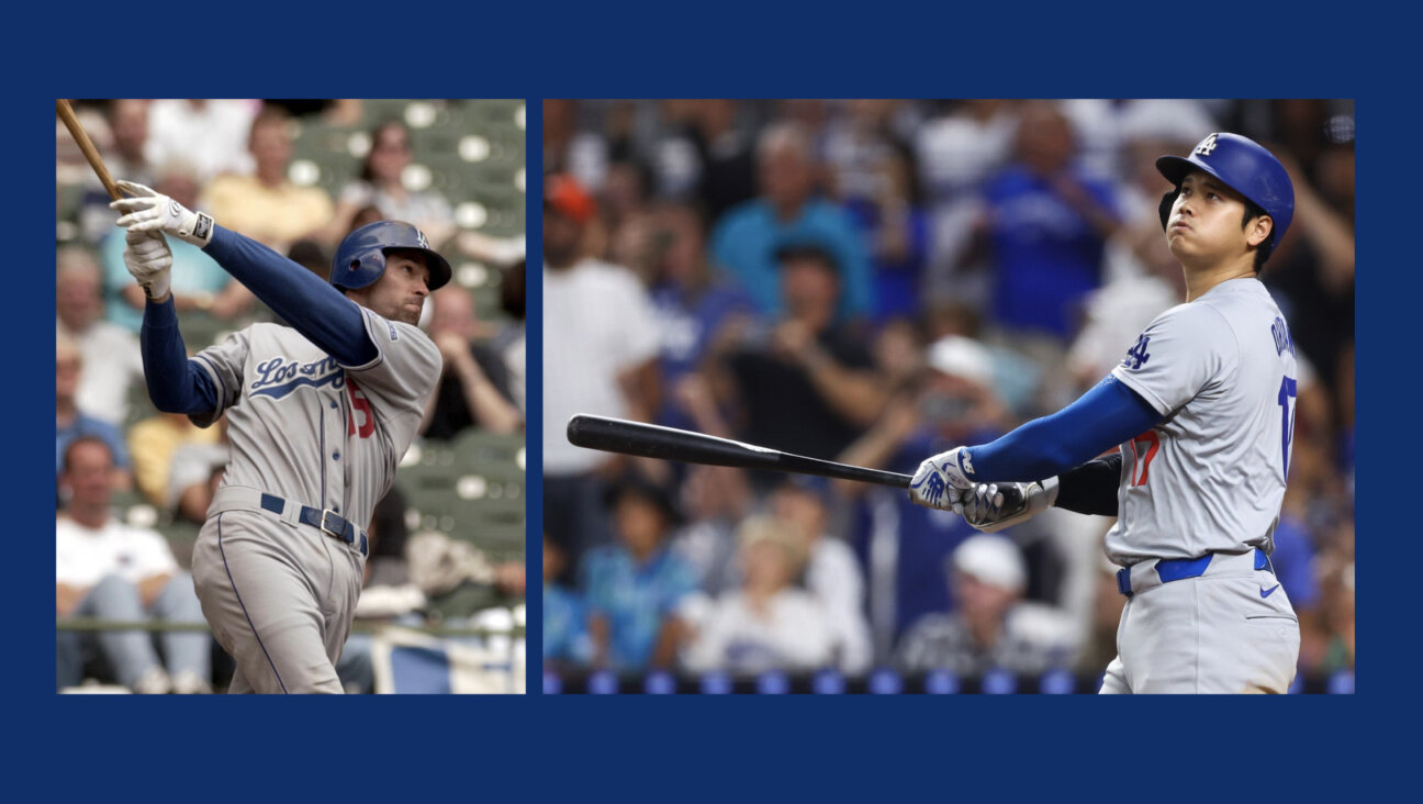 Shawn Green, left, hit 49 home runs in 2001, a Dodger record that stood until Shohei Ohtani broke it Thursday.