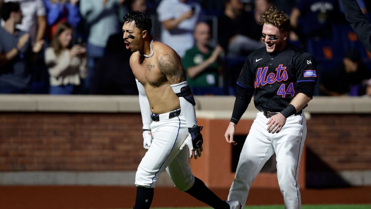 Mark Vientos, left, celebrates his game-winning two-run home run against the Cincinnati Reds with teammate Harrison Bader, Sept. 6, 2024, in New York City. (Jim McIsaac/Getty Images)