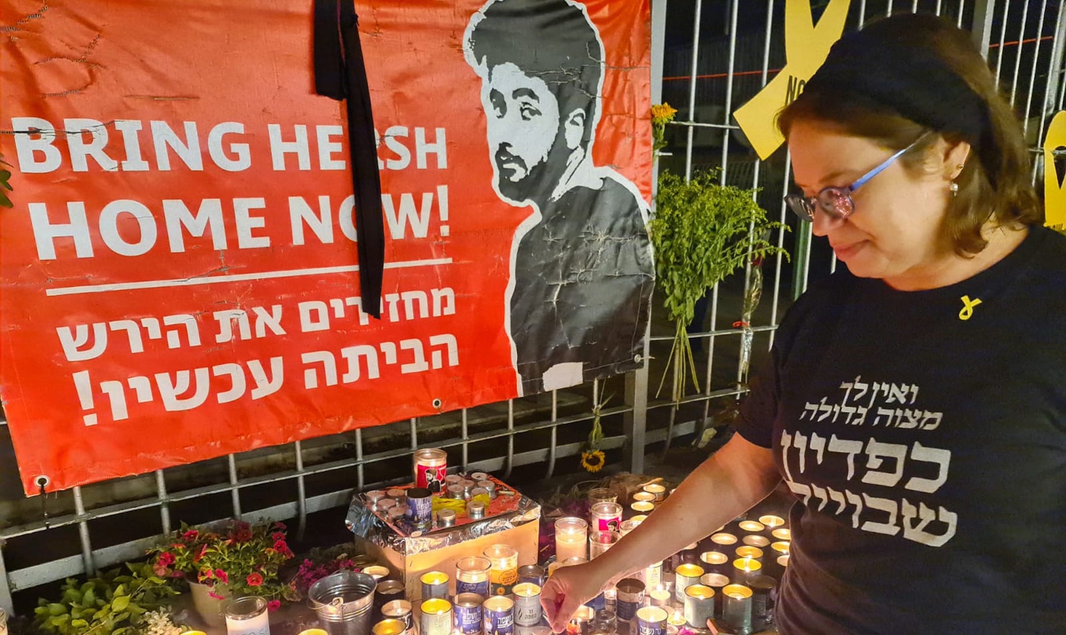 Shira Ben-Sasson, a founder of the Hakhel synagogue in Jerusalem, lights a candle in memory of Hersh Goldberg-Polin, Sept. 1, 2024. (Deborah Danan)