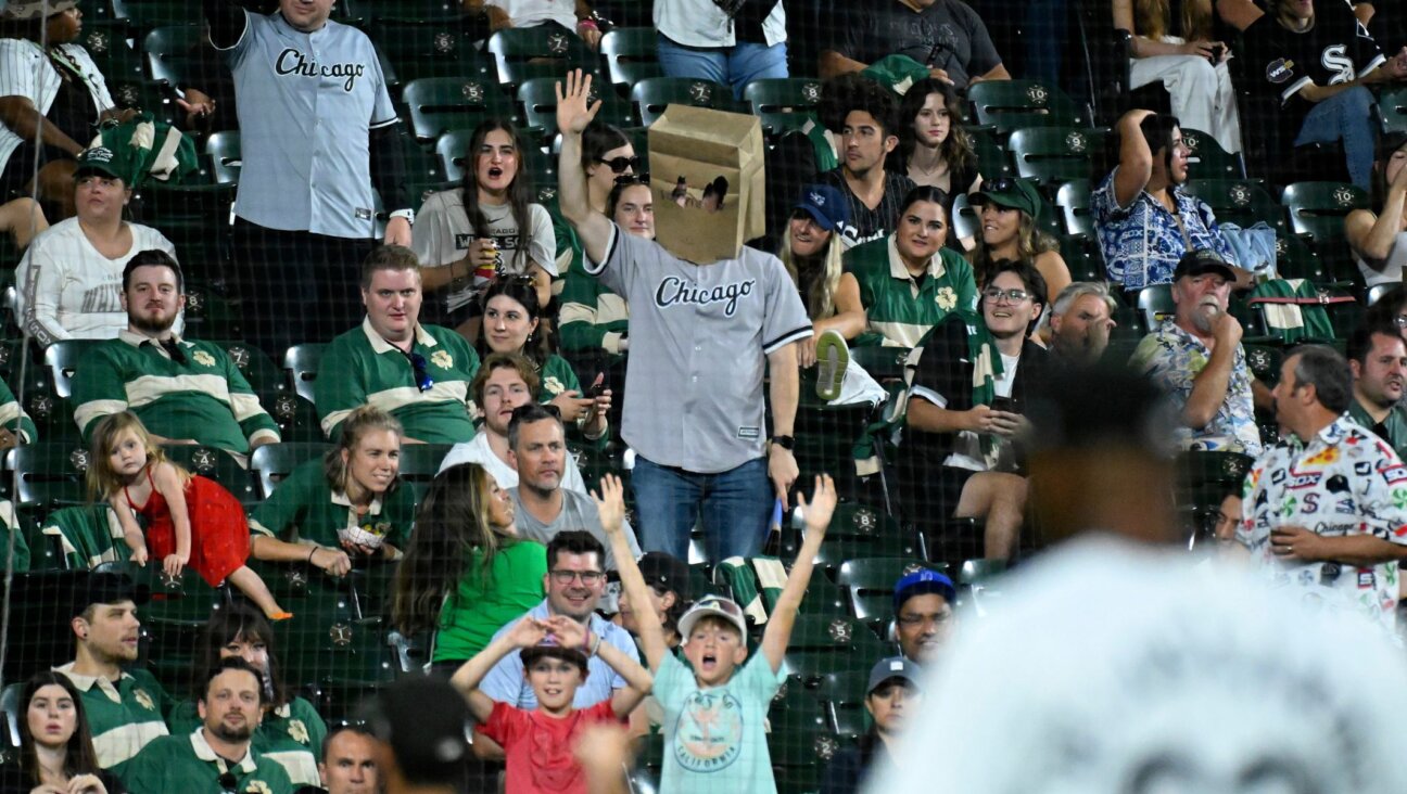 A fan wears a paper bag over his head during a game between the Chicago White Sox and the Oakland Athletics at Guaranteed Rate Field, Sept. 14, 2024, in Chicago. (Nuccio DiNuzzo/Getty Images)