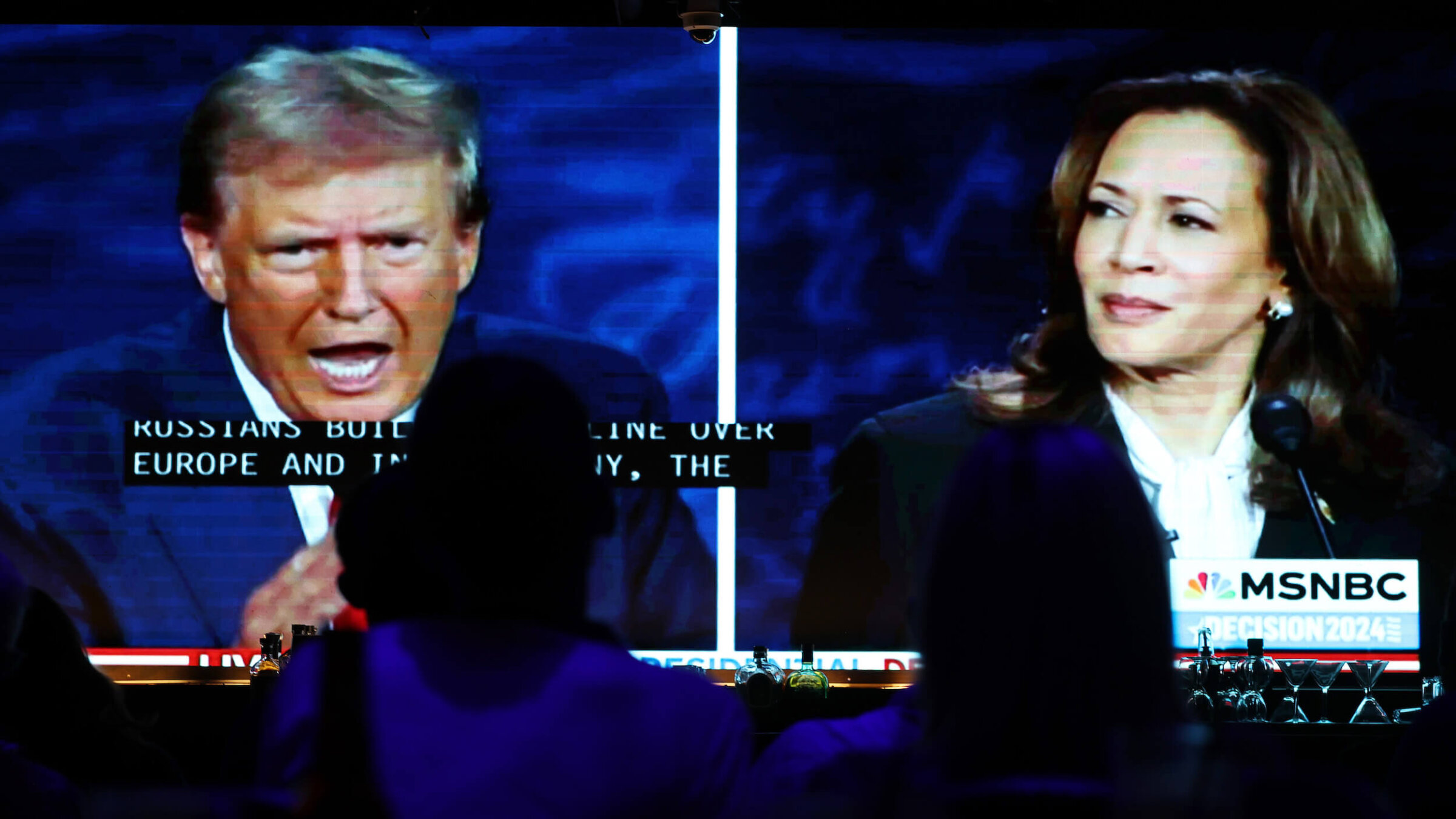 People watch the debate in September between Democratic presidential nominee, Vice President Kamala Harris, and Republican presidential nominee, former President Donald Trump. 