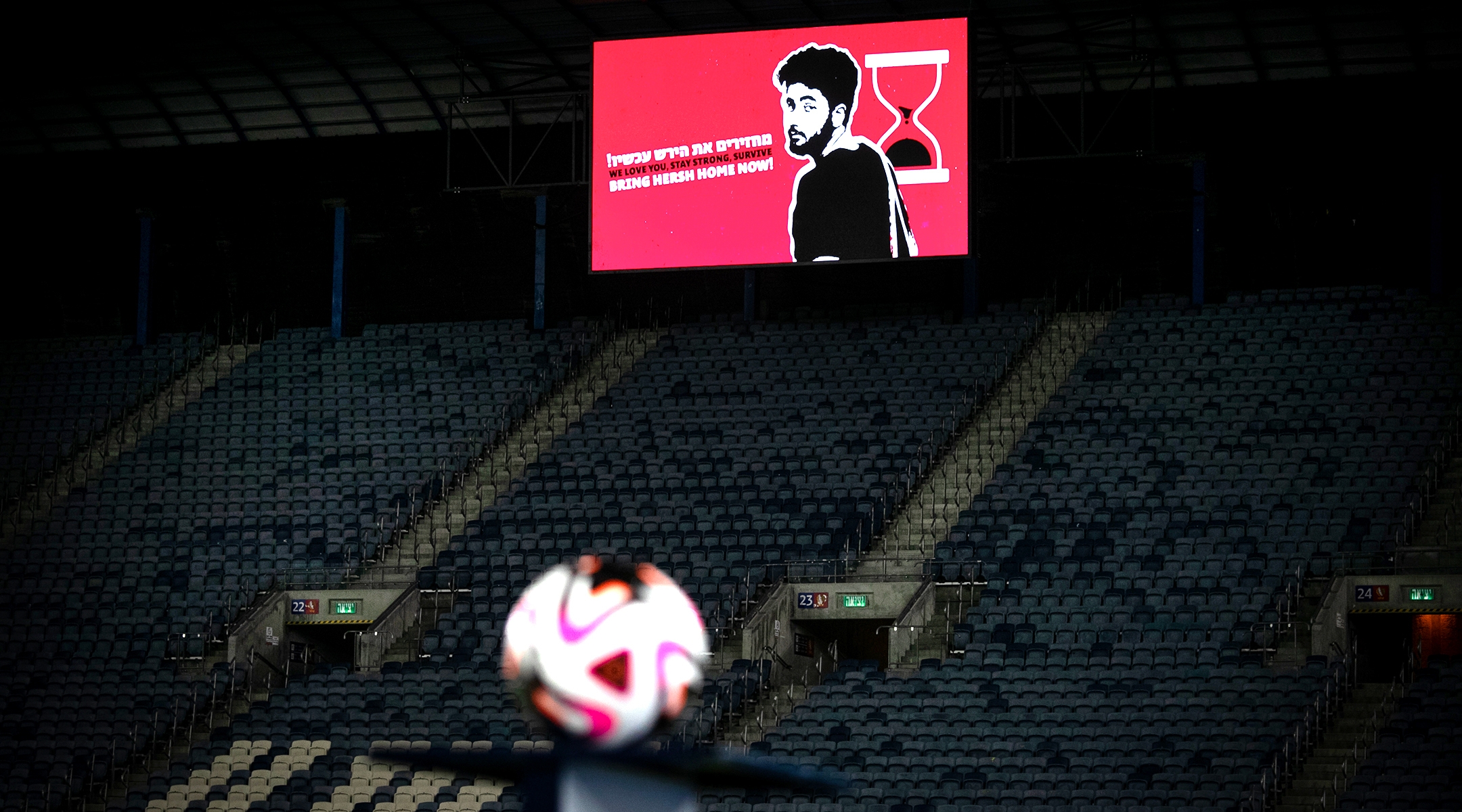 Hersh Goldberg-Polin seen on a screen during the Israeli Premier League match between Hapoel Hadera and Hapoel Jerusalem, Aug. 31, 2024, in Jerusalem. (Oren Ben Hakoon/Flash90)