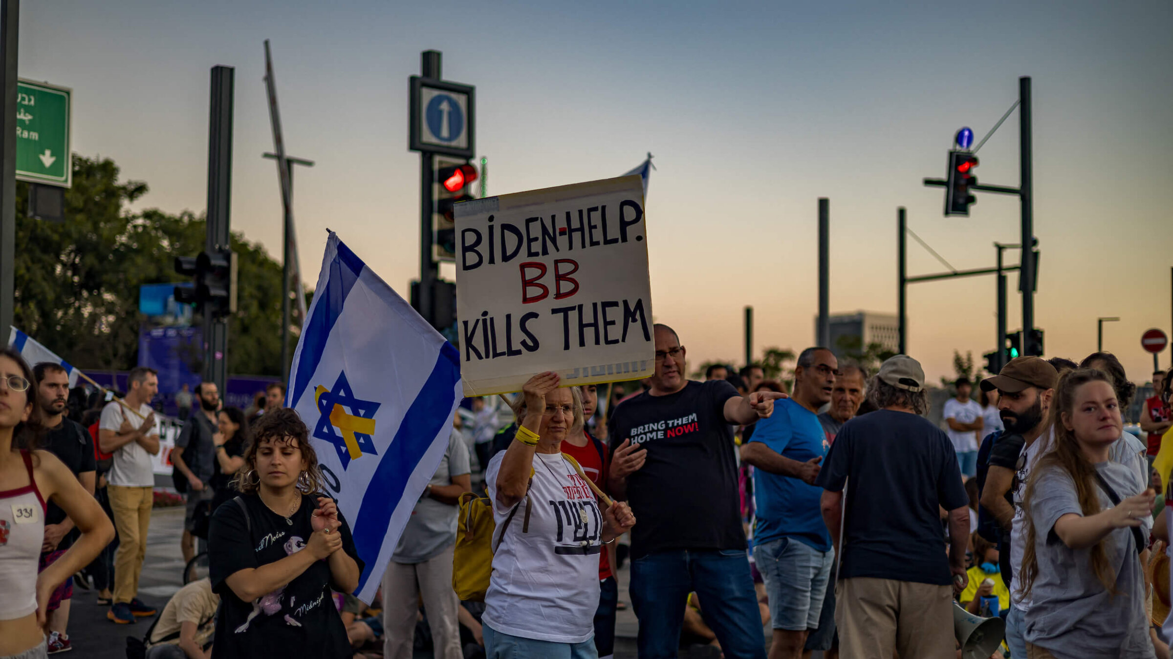 A protester holds a sign saying "Biden helps. BB kills them" at a Sept. 1 demonstration in Jerusalem for the release of the hostages, following the news of the murder of six hostages held by Hamas.