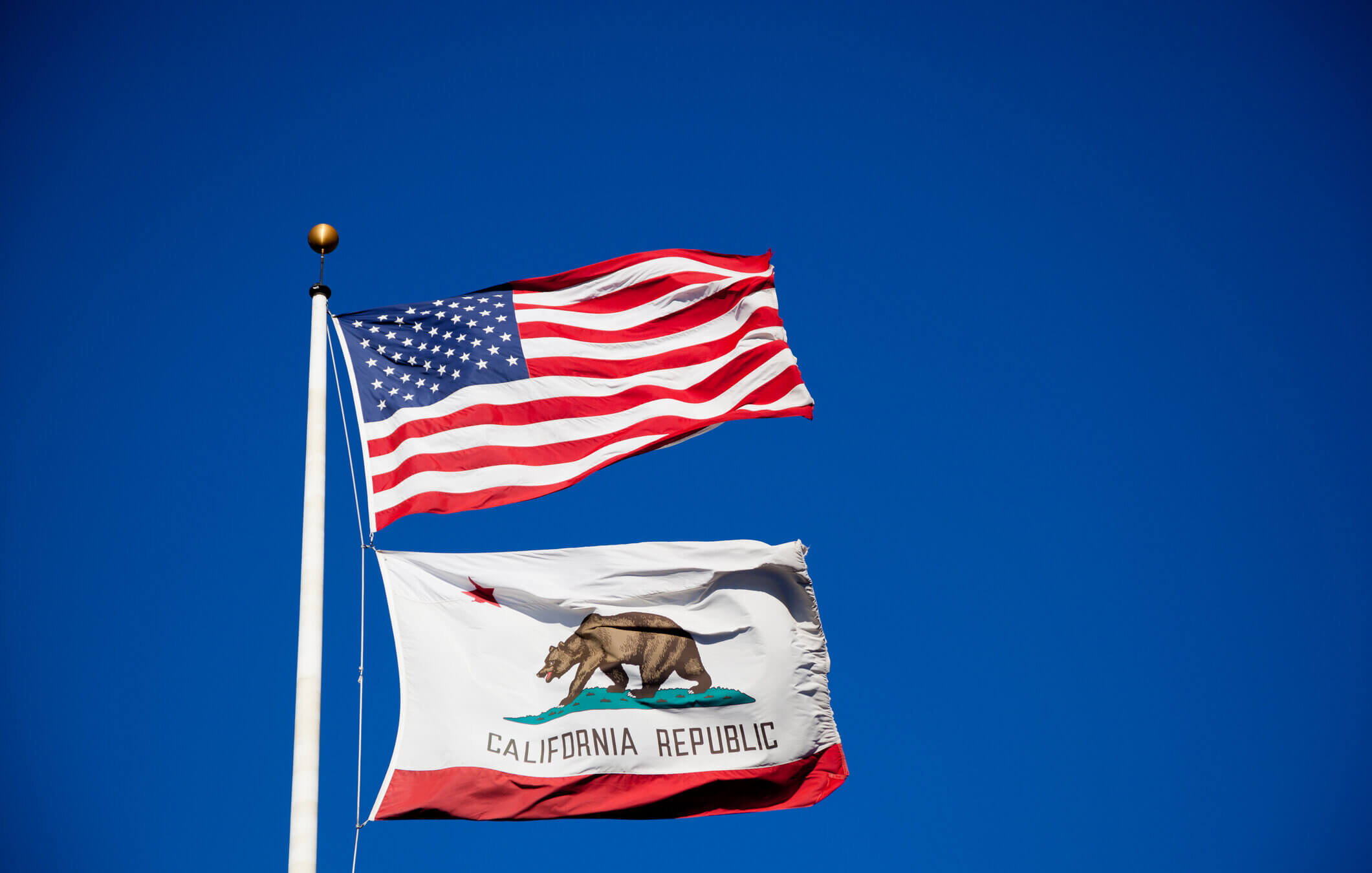 The flags of the USA and California