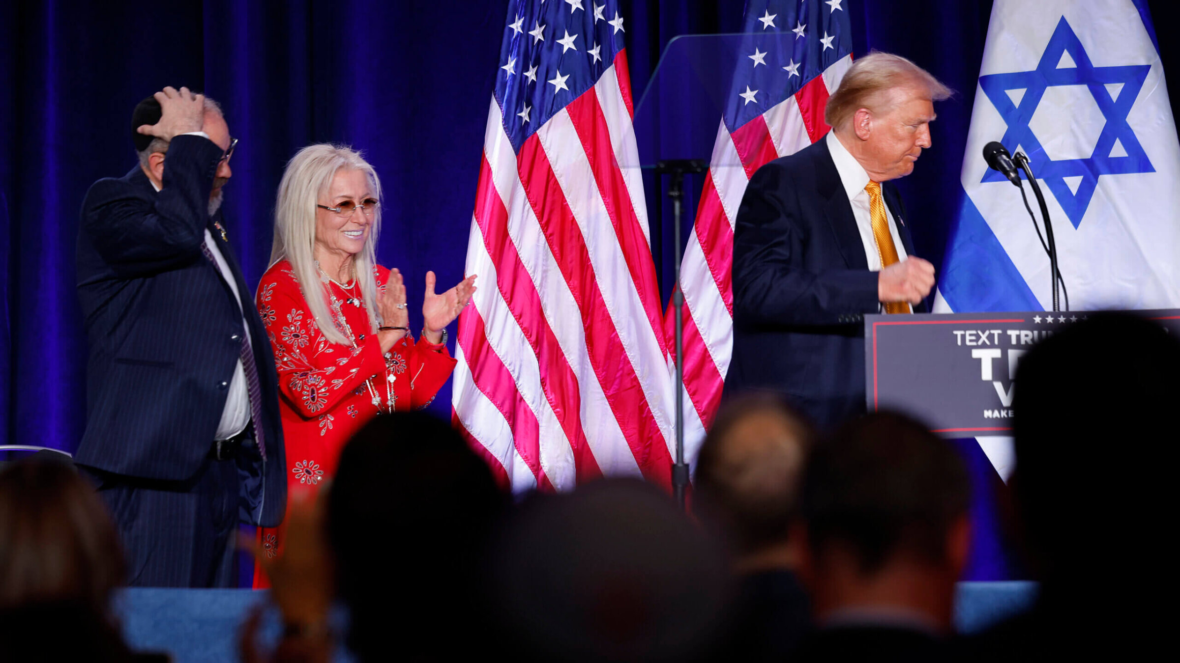 Miriam Adelson, widow of billionaire casino magnate Sheldon Adelson, applauds as former President Donald Trump leaves the stage at an event titled "Fighting Anti-Semitism in America" on Sept. 19. 