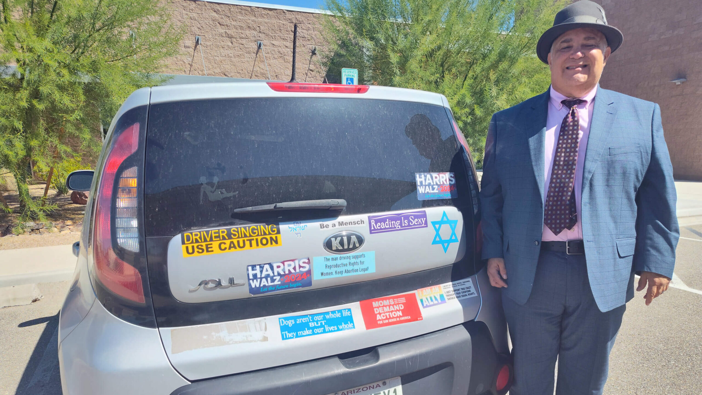 The bumper of Tony Zinman’s car is a billboard for who he is and what he cares about 