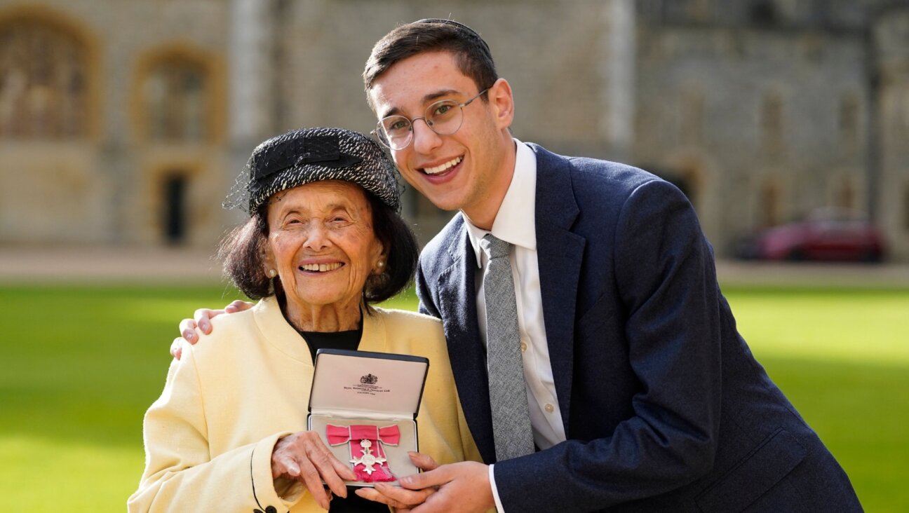 Lily Ebert, left, poses with her great-grandson Dov Forman after a ceremony where she was appointed a Member of the Order of the British Empire. (Andrew Matthews, AFP via Getty Images)