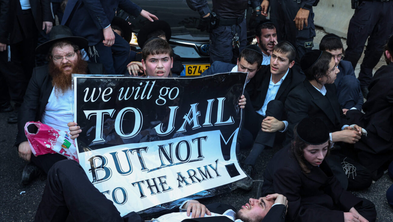 Israeli police officers clash with Ultra-Orthodox Jewish men during an Ultra-Orthodox protest against army draft on July 16, 2024 in Bnei Brak, Israel.