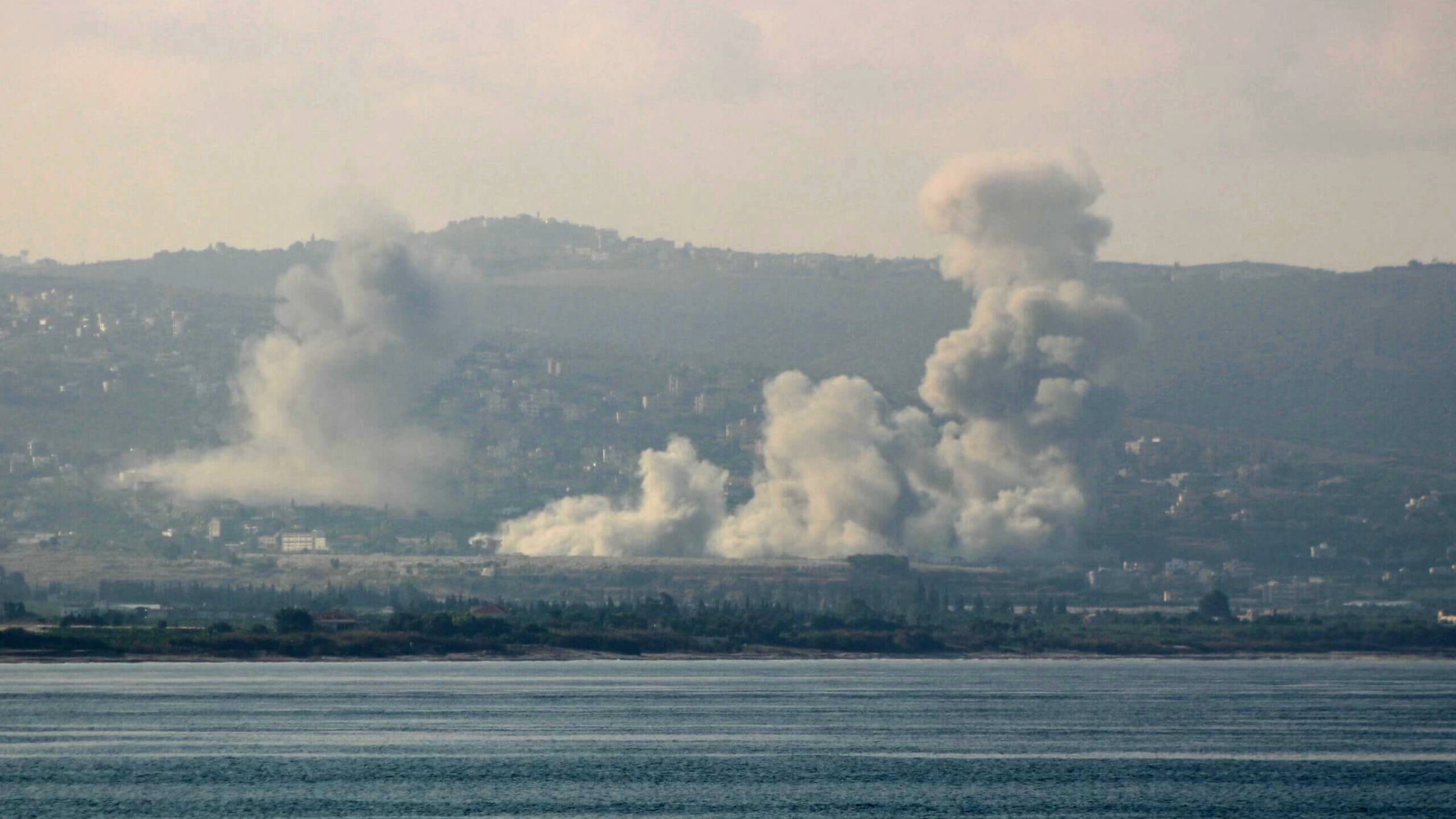 A picture taken from the southern Lebanese city of Tyre shows smoke rising from the site of an Israeli strike targeting southern villages on October 13, 2024, amid the continuing war between Hezbollah and Israel. 