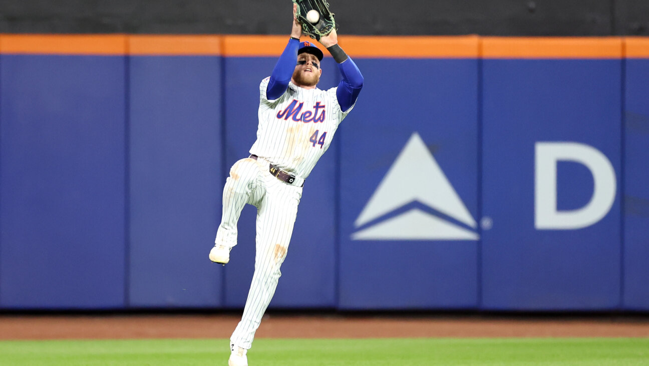 Jewish center fielder Harrison Bader of the New York Mets catches a fly ball during Game 3 of the division series at Citi Field. 