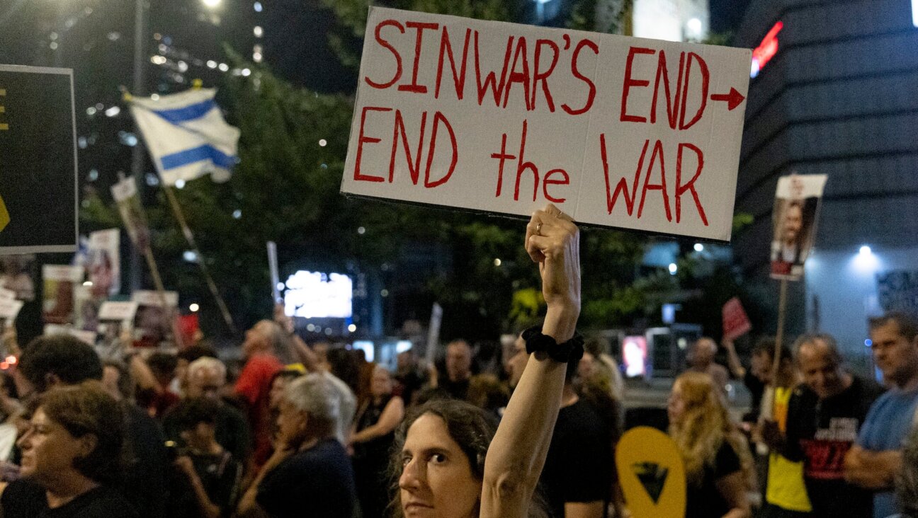 A protester holds a sign during a demonstration calling for a hostages deal in Tel Aviv, Oct. 17, 2024. 