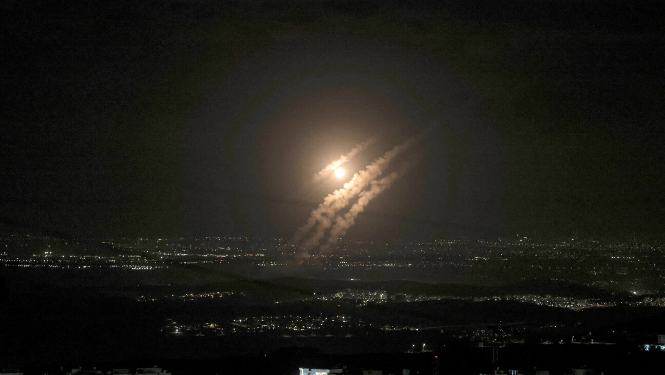 Projectiles from Iran's Tuesday airstrike on Israel fall above the city of Ashdod, seen from Hebron in the West Bank. 