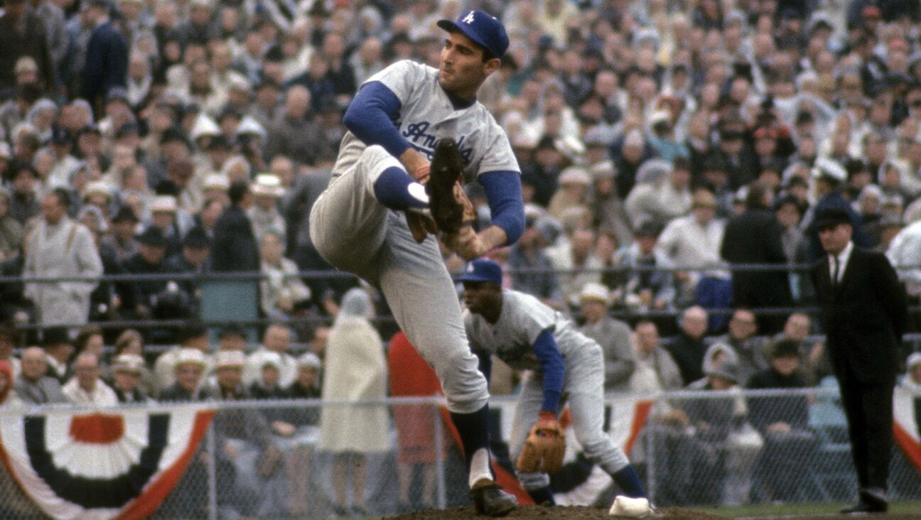 Sandy Koufax pitches during Game 7 of the 1965 World Series between the Los Angeles Dodgers and the Minnesota Twins, Oct. 14, 1965, at Metropolitan Stadium in Minneapolis. (Focus on Sport/Getty Images)