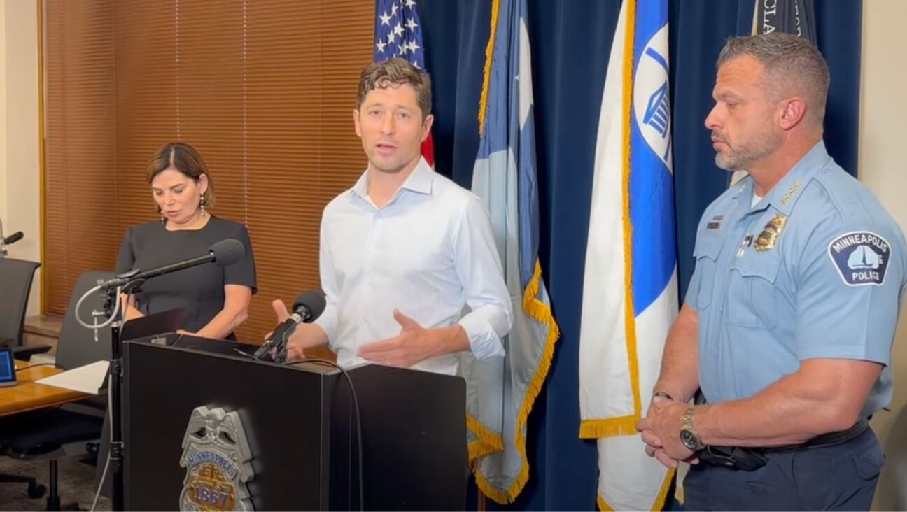 Minneapolis Mayor Jacob Frey, center, speaks at a press conference alongside Temple Israel senior rabbi Marcia Zimmerman, left, and Minneapolis Police Chief Brian O’Hara, right, Oct. 5, 2024. (Screenshot from YouTube)