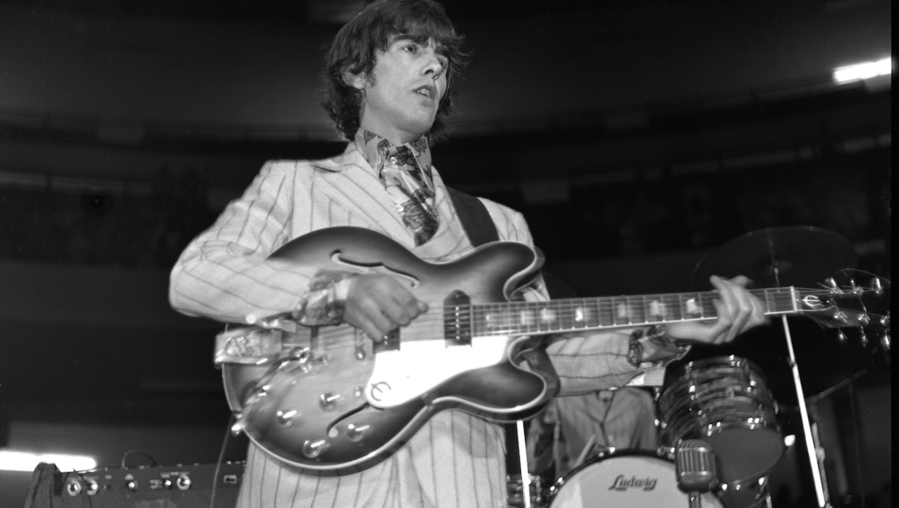 George Harrison playing Olympia Stadium in Detroit in 1966.