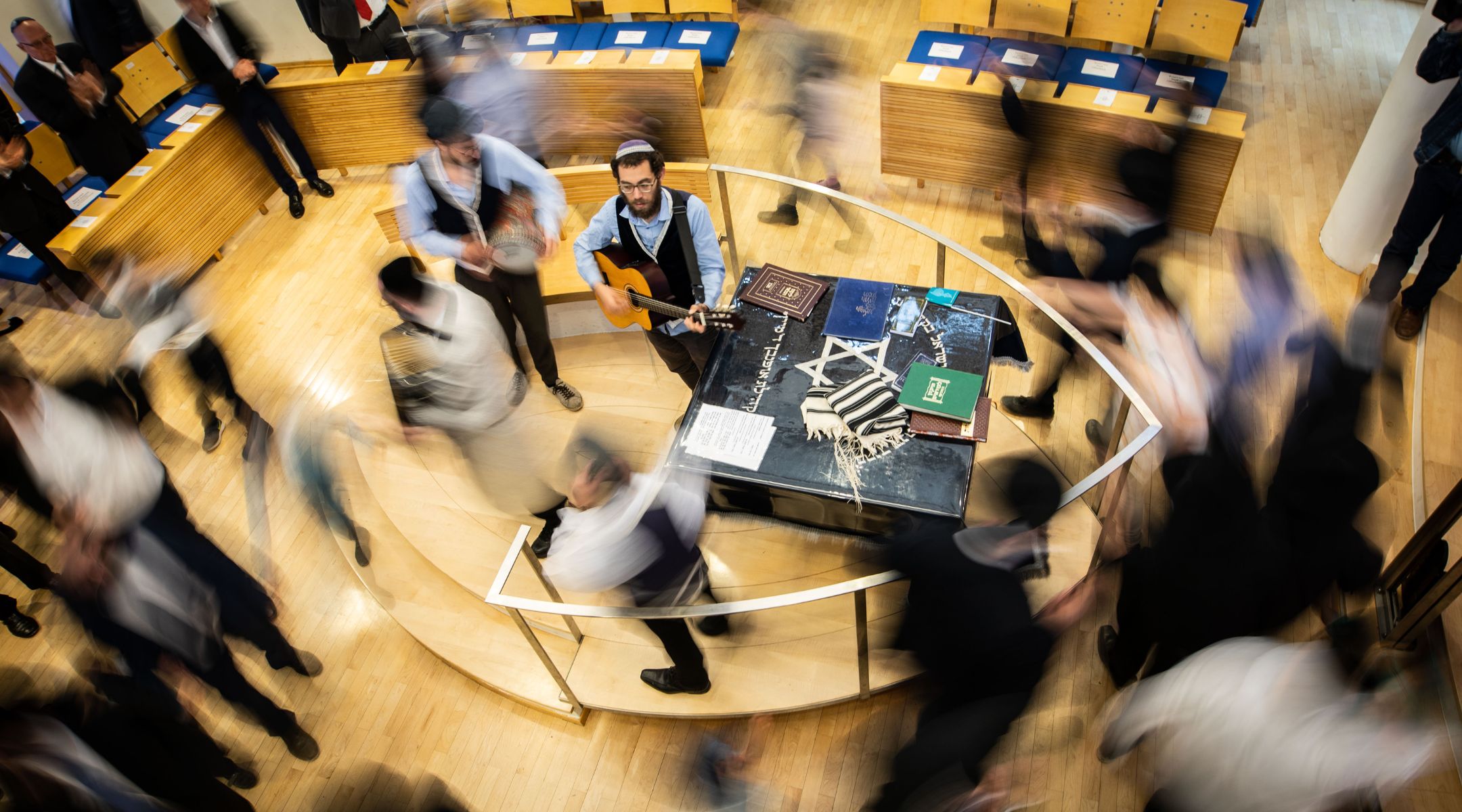 Hakafot — circular dances around the Torah — are a key ritual on the holiday of Simchat Torah. (Frank Rumpenhorst/picture alliance via Getty Images)