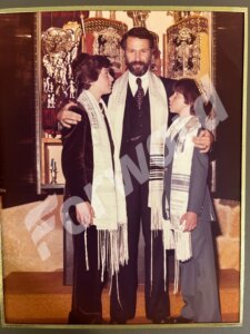 Doug Emhoff, left, and Scott Bermack, right, with Rabbi Henry Weiner at their Nov. 1977 bar mitzvah. 