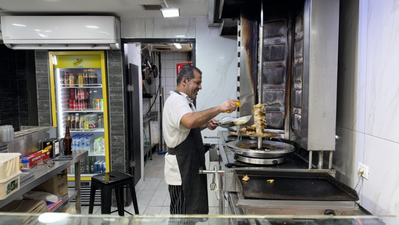 The falafel guy at Shula on October 1, 2024 in Tel Aviv, minutes after Iran's ballistic missile attack on Israel concluded.