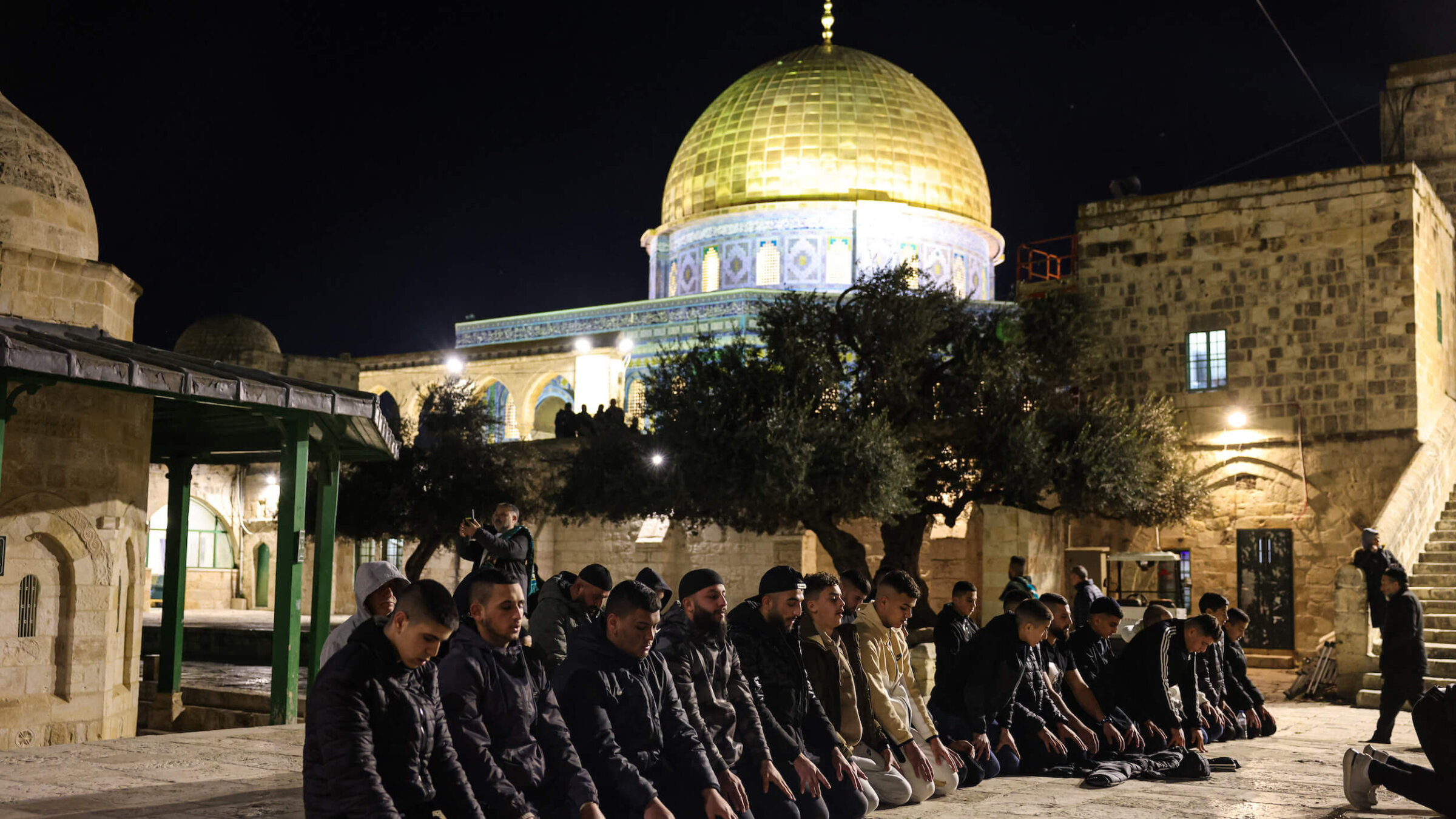 Palestinian Muslims perform an evening prayer known as 'Tarawih' outside Jerusalem's al-Aqsa Mosque compound on March 11. 