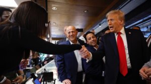 Republican presidential nominee former President Donald Trump greets an employee during a visit to The Great Commoner cafe, Dearborn, Michigan, Nov. 1, 2024. (Chip Somodevilla/Getty Images)