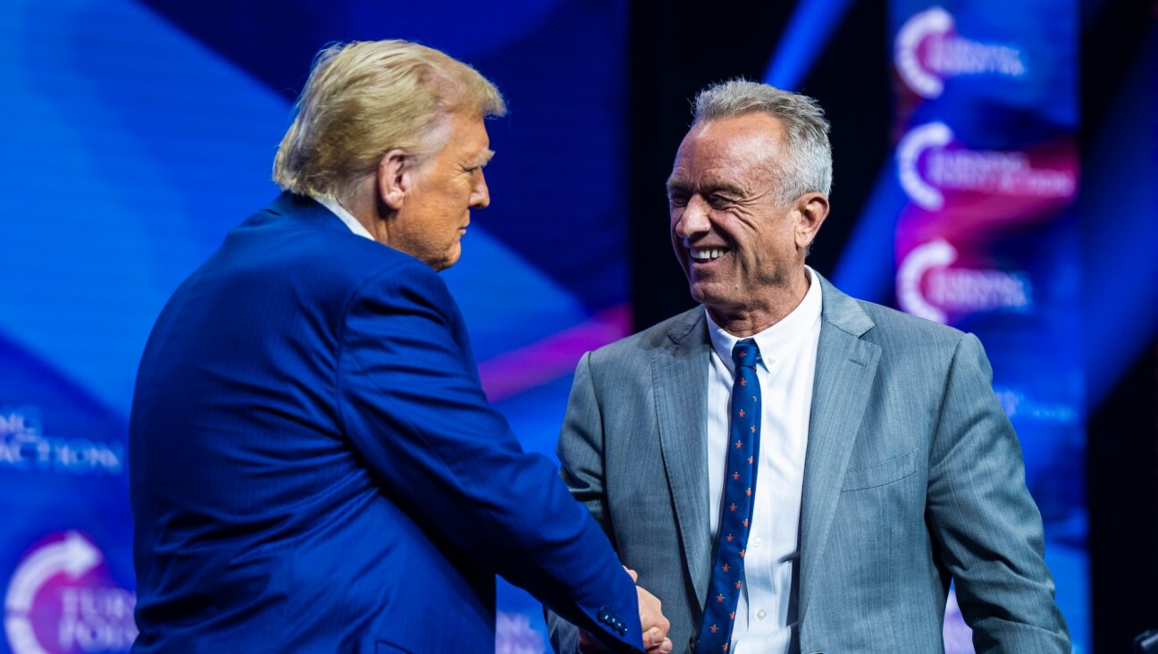 Robert F. Kennedy Jr. speaks with Republican presidential nominee former President Donald Trump at a Turning Point Action Rally in Duluth, Georgia, on Wednesday, Oct. 23, 2024. (Jabin Botsford/The Washington Post via Getty Images)