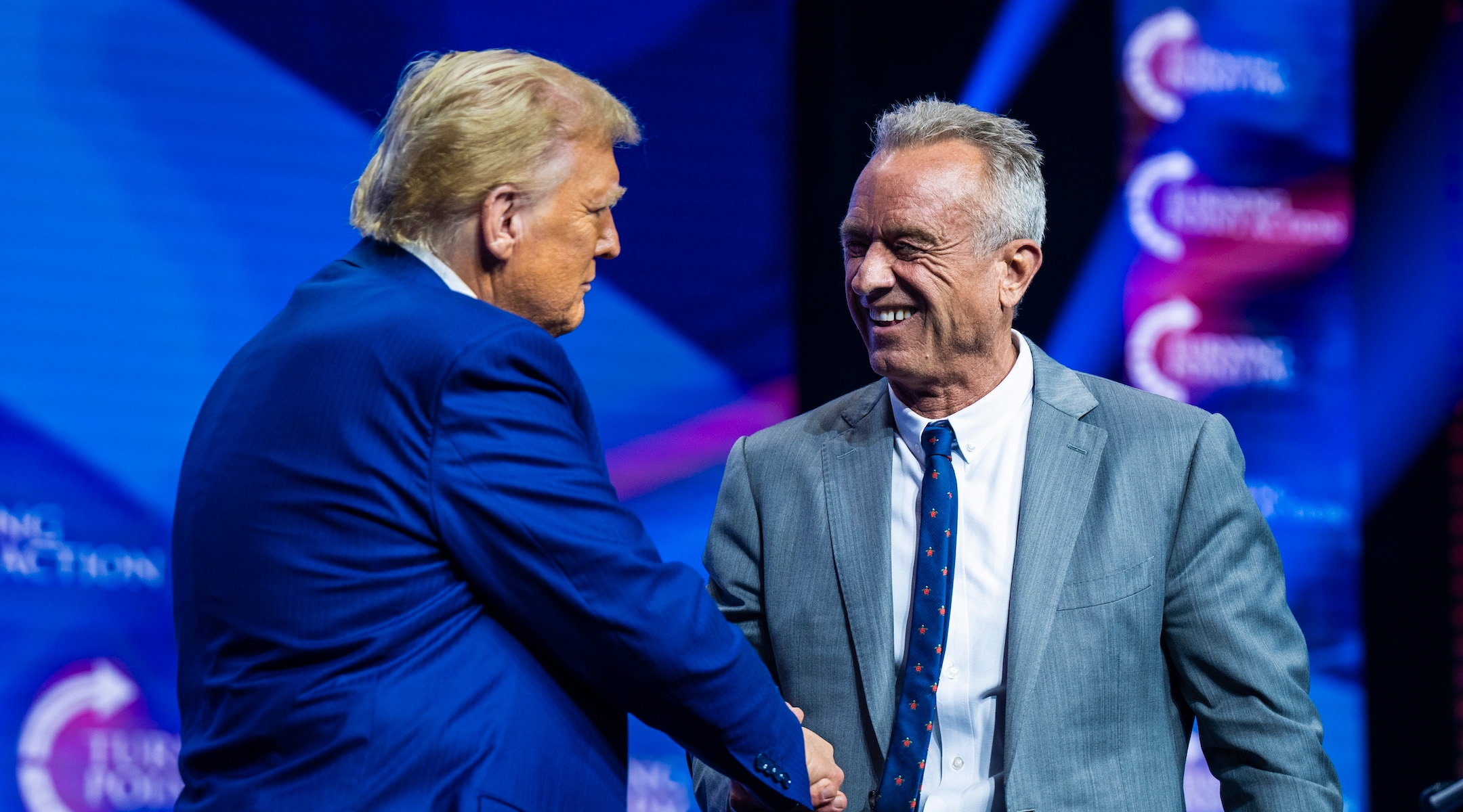 Robert F. Kennedy Jr. speaks with Republican presidential nominee former President Donald Trump at a Turning Point Action Rally in Duluth, Georgia, on Wednesday, Oct. 23, 2024. (Jabin Botsford/The Washington Post via Getty Images)